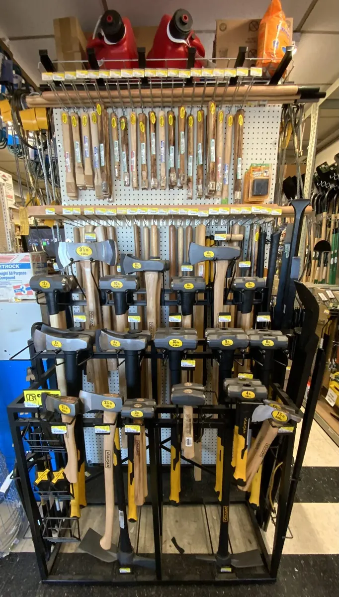Hammers, axes and striking tools on a rack
